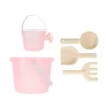 Pink plastic kids' sand set including bucket, small bucket with handle, shovel, rake, sifter spoon and scoop ladle in beige tones