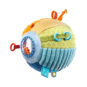 Colorful plush sensory ball for babies with textured fabrics, ribbons, and a bead-filled window on the side.