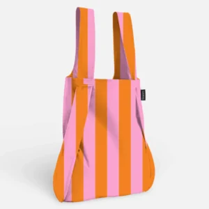 Reusable tote bag with bold pink and orange vertical stripes and long handles, shown from the side on a neutral background (informative product image).