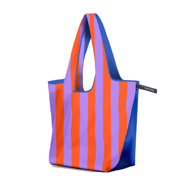 Striped tote bag with orange and purple vertical stripes and blue sides, standing upright.