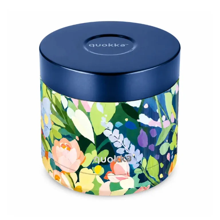 Blue-lidded cylindrical tin with a bright floral wrap and the Quokka logo on the front.
